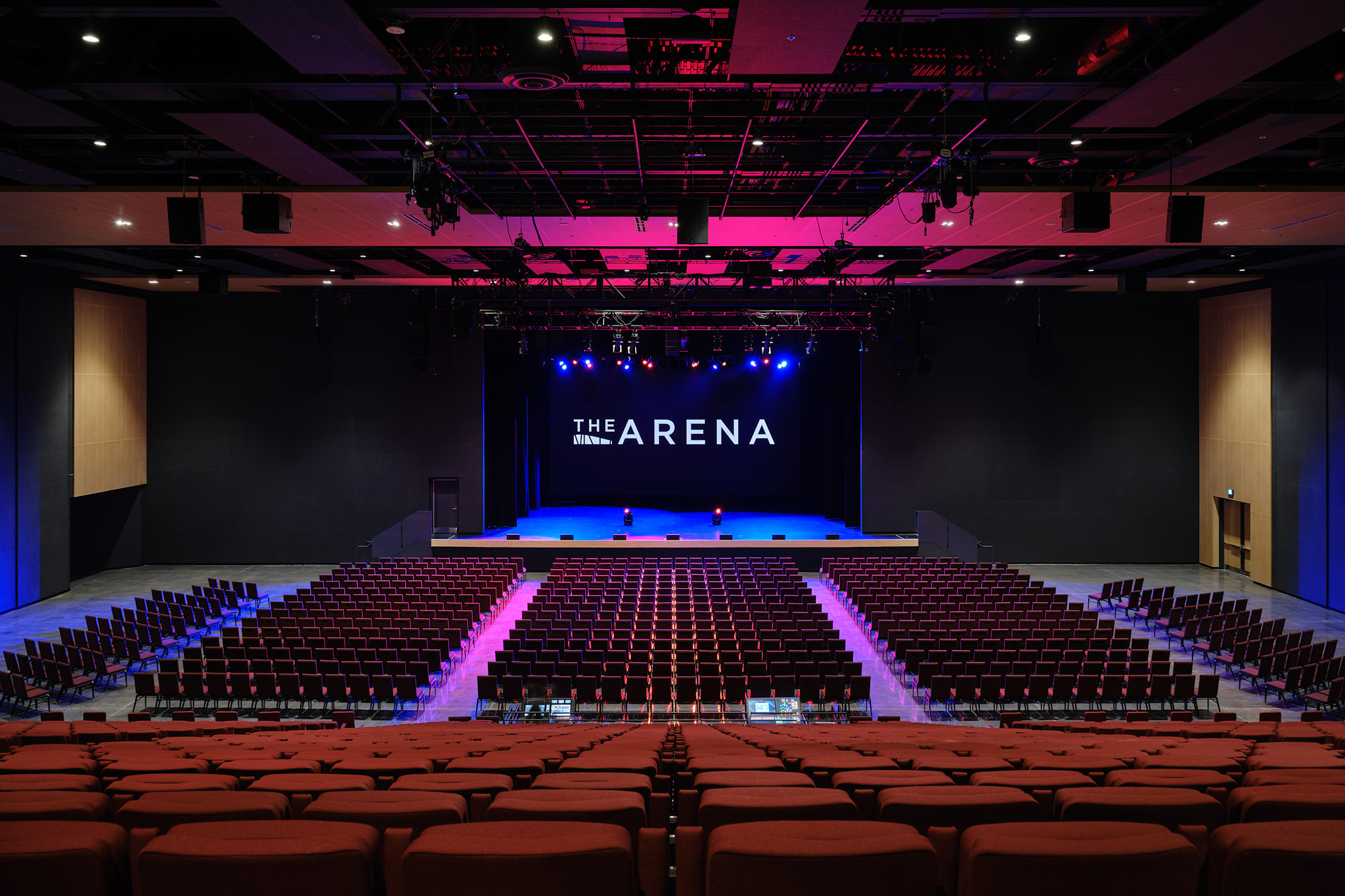 Interior of The Arena at Pickering Casino Resort with stage lighting and audience seating